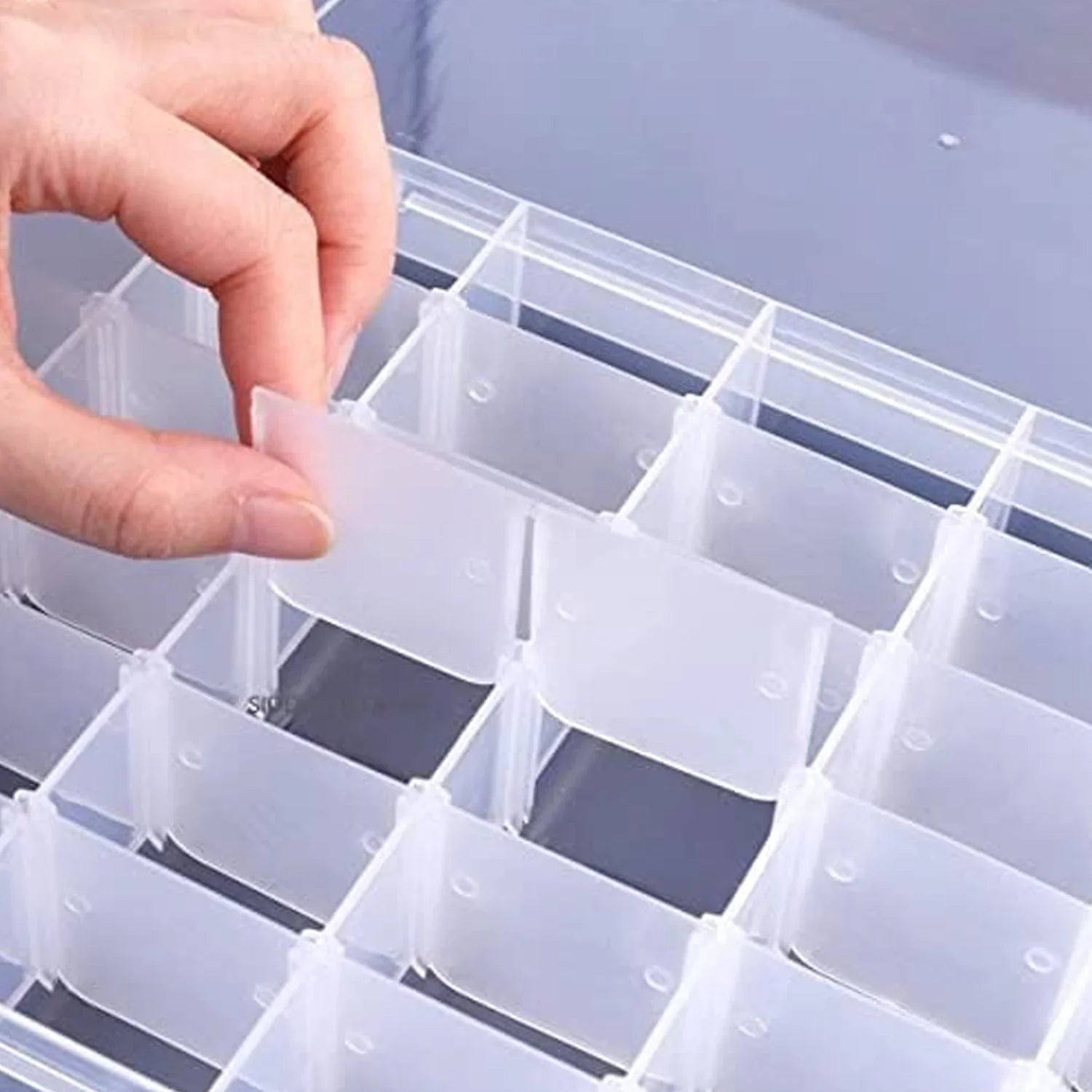 Clear plastic organizer with adjustable dividers Clear plastic organizer with adjustable dividers